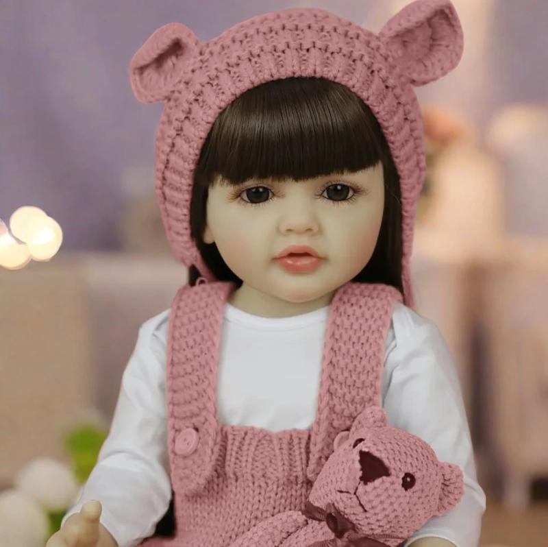22" Realistic Princess Doll with Long Brown Hair & Pink Bodysuit - Silicone Baby Doll with Teddy Bear Stuffed Animal & Accessories - Sitting & Standing - Perfect Christmas Gift or Birthday Present for Collectors