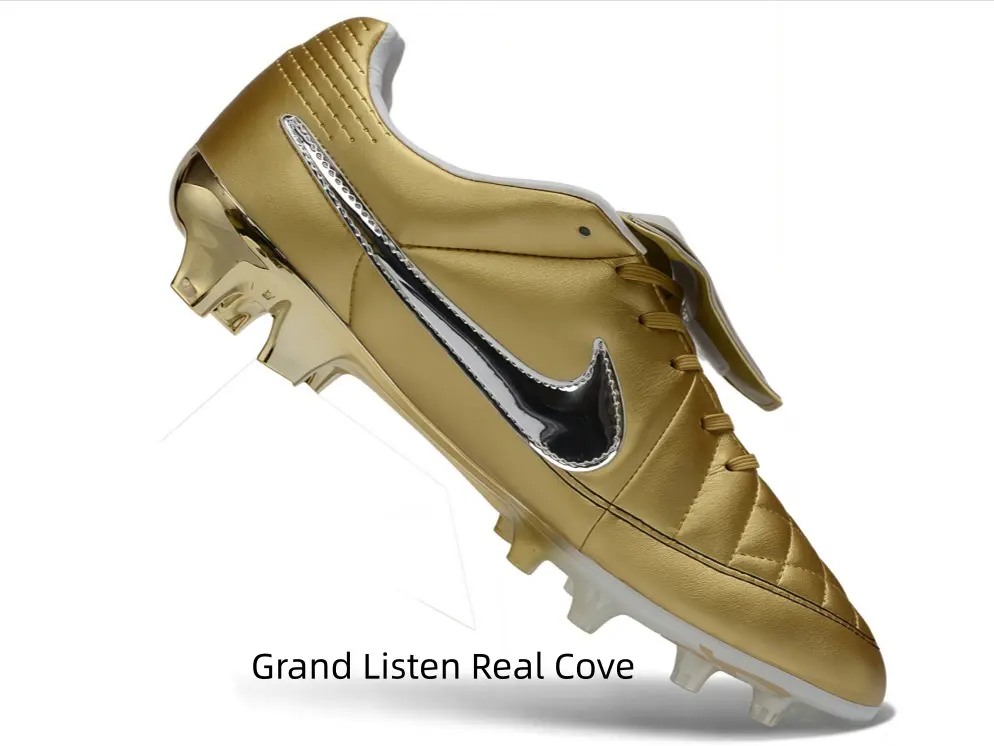 Full metallic gold firm-ground soccer cleats with shiny silver graphic and quilted leather upper