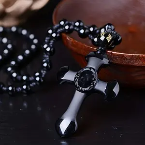 An obsidian necklace with a religious cross lucky symbol pendant and paired with a black synthetic gem chain, suitable for gifts for men and women.