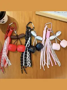 Korean-style sweet and cool cherry bag charm with woven rope, lace, and beads, available in multiple colors, bag accessory gift