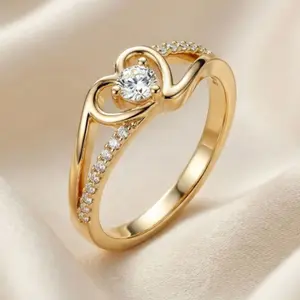 This elegant and sophisticated 14k gold-plated heart-shaped ring, adorned with Cubic Zirconia stones, is perfect as a wedding or engagement gift, for everyday wear, or for parties.