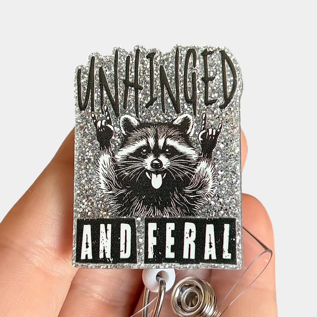 Glitter My Badge Unhinged and feral raccoon badge reel for nurse and hospital workers. Badge clip Badge pull - Retractable swivel clip with a 360 rotation. Great gift for coworker. Badge reel for men.