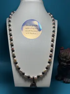 Cultured freshwater pearl and hematite necklace.