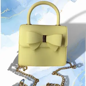 Yellow Bow Purse with Chain Strap and Elegant Design