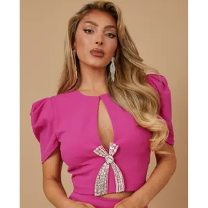 FASHION CROP TOP WITH BOW HARDWARE TRIM DETAIL - SLIT DETAIL, SHORT SLEEVE, ZIPPER IN THE BACK