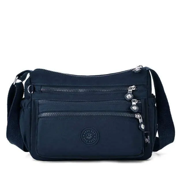 Casual Multi-Layer Crossbody Bag for Women, Water-Resistant Nylon Sling Purse with Multiple Zippered Pockets  Wide Strap for Travel &  Nylon Fabric, Multiple Layers, Crossbody Sling, Adjustable Strap, Anti-Theft, Buckle nylon fanny pack solid color