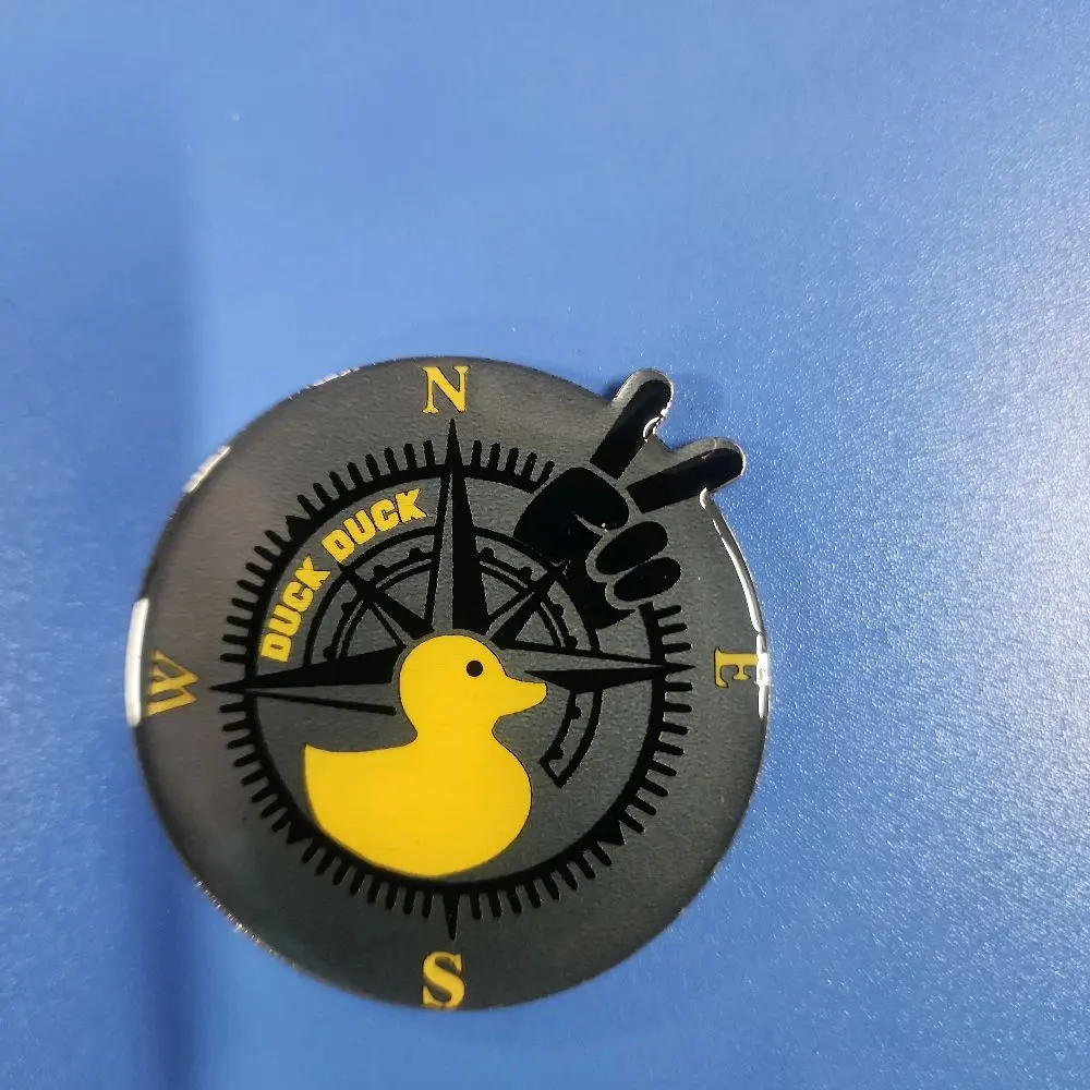 Custom "Duck Duck" Yellow & Black Badge with Compass Design and Unique Yellow Duck Graphic