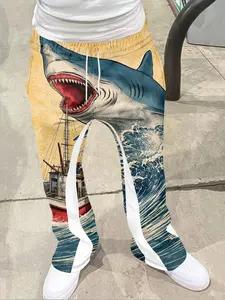 1 pair of shark themed street style casual pants, paired with the word "SHARK", with black, orange, and green as the main colors, featuring a retro vintage texture. The pants are infused with wave patterns, adding a trendy street vibe Casual Comfy Pants