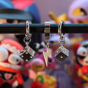 Gambling freak set - A 3‑piece silver hoop set with dice and lightning charms for an edgy street look.