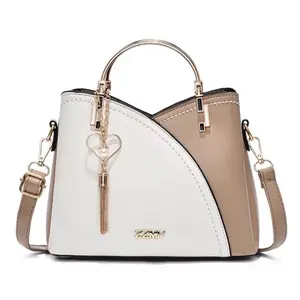 Bolso de mano para dama. Bolso de lujo. Material sintético de alta calidad. Tres colores.