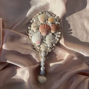 Seashell handheld mirror