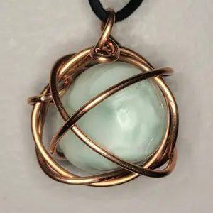 polished larimar necklace wrapped in copper