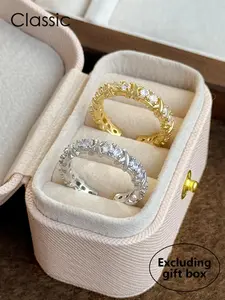 A set of two simple, high-end, light luxury, unique and distinctive women's rings inlaid with artificial zircon and crossed copper materials