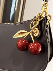 A fashionable and cute cherry design Kevchain, bag decoration, Bag Pendant, daily wear, also a surprising and exquisite small gift.
