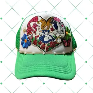 Trucker Hat with Embroidered Patch and Chain Detail Featuring Alice in Wonderland Design and Green Brim