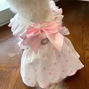 A Pet Dress with a Pink Bow, Breathable, Featuring a Leash Attachment, Suitable for Spring, Summer, And Autumn. Ideal for Small Dogs Like Teddy, Bichon, Pomeranian, And Cats, with a Heart Design