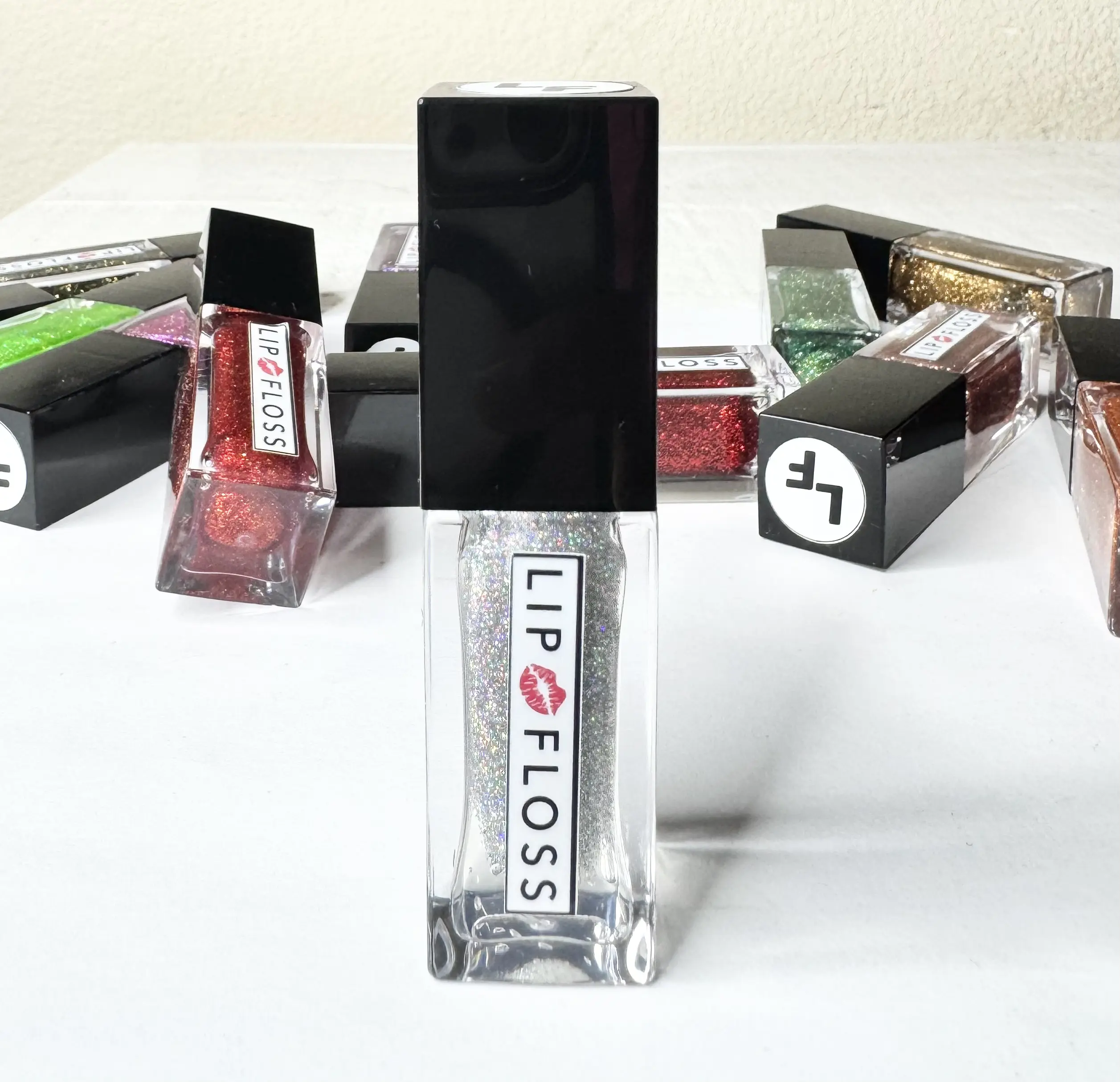 Shimma Lemma Lip Floss High Shine lip gloss is a non-sticky formula enriched with shea butter and vitamin E to moisturize and soften lips. It provides a high-shine, lightweight, and is long-lasting with a bling finish   4.5ml