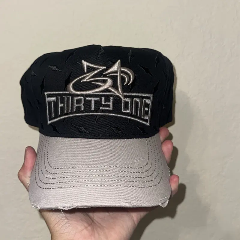 Black hat with tire like marks
