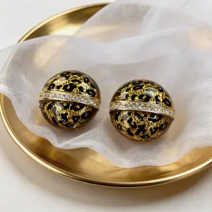 Traditional gold-plating earrings with diamond accents and leopard pattern