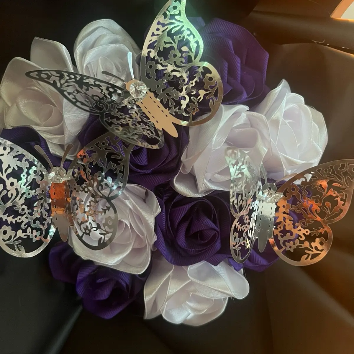 Three ribbon roses