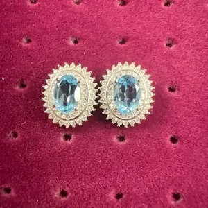 <PingEast jewelry > EDP606----925 Sterling Silver Stud Earrings with 5*7mm Oval Sunflower Design, Featuring Eye-Clean Natural Sky Blue Topaz