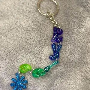 Custom Name Keychain with Blue and Green Glitter Design and Floral Charm