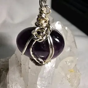 Amethyst Crystal Pendant - Elegant Design with Wire Wrap Accent and Purple Gemstone Centerpiece