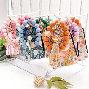Fragmented Design Silicone Bead Bracelet Keychain Pu Leather Flower Pattern Wristlet Wallet Keychain Beaded Detail