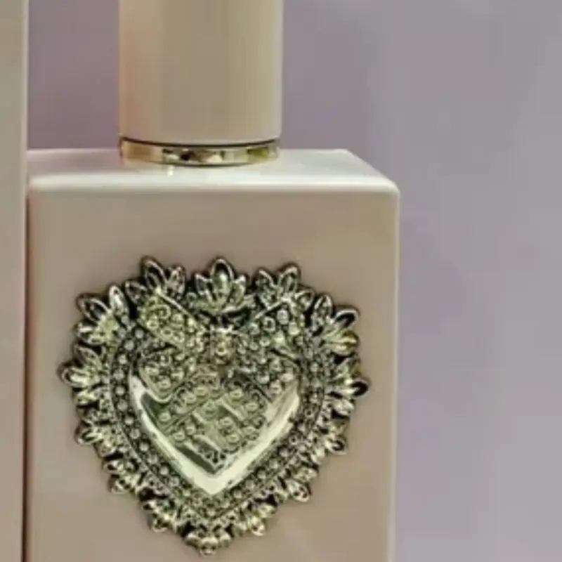 Elegant gold Perfume Spray Bottle – with Atomizer with heart embedded