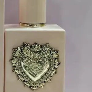 Elegant gold Perfume Spray Bottle – with Atomizer with heart embedded