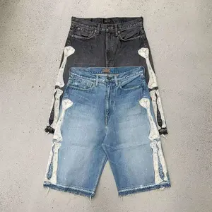 Retro nostalgia meets avant-garde design! Denim mid-length shorts with a bone-texture design—detail lovers will go wild! Made using a washed distressed process, both black and blue have a vintage faded look.