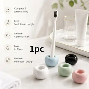 Minimalist style ceramic toothbrush holder, single-slot toothbrush stand, glossy round bathroom toothbrush organizer, space-saving countertop toothbrush base, modern-style toothbrush storage rack for bathroom sinks, available in multiple colors
