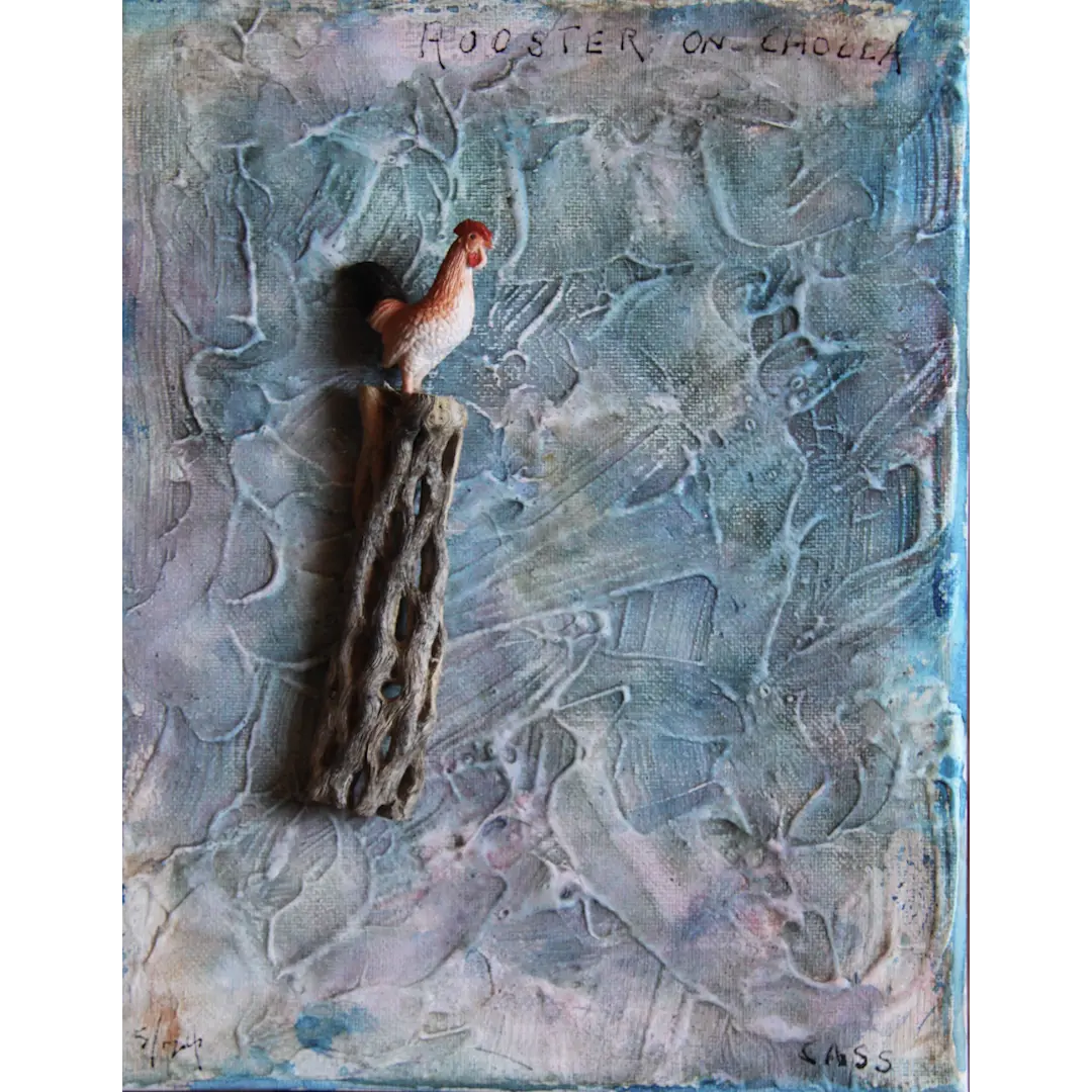 Rooster on Cholla - A small, realistic toy rooster stands atop a textured piece of cholla wood...