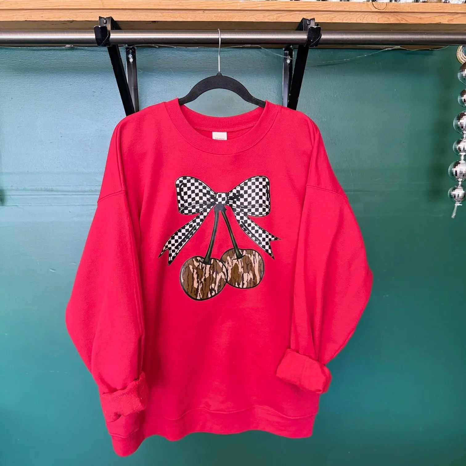 Checkered and Camo Cherry print on our Deep Red 50/50 blend Crew Neck Sweater