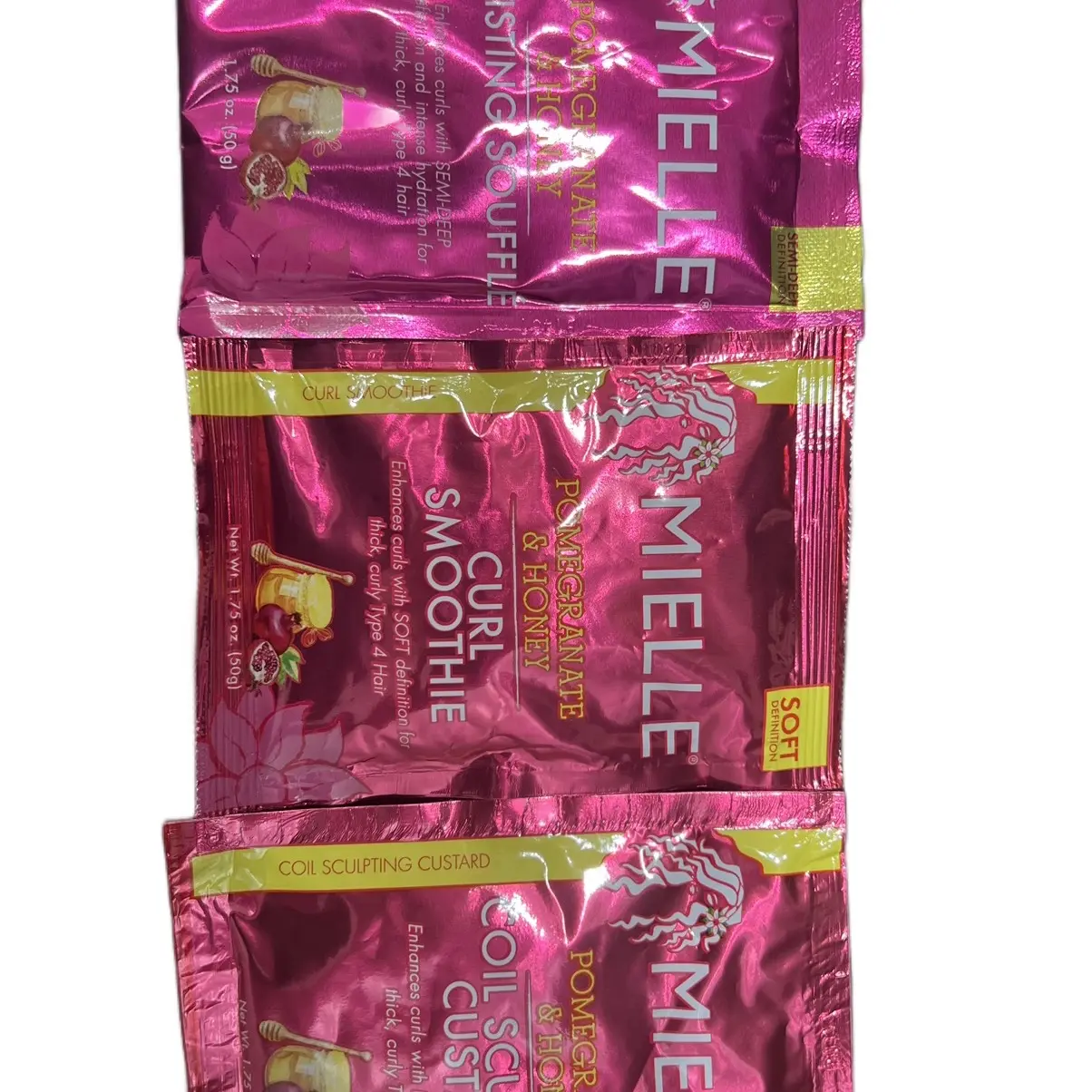 Miellé Pomegrante and Honey Curl smoothie, twisting soufflé, and coil sculpting custard sample packs.