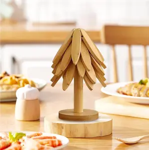 Natural Tree Trivet Set - Christmas Tree Design! This heat-resistant set includes 4 Wooden Trivets and 1 Stand, stored like a Christmas tree. perfect for pots, bowls, coffee mugs, teapots, and hot pots. Foldable kitchen decor art
