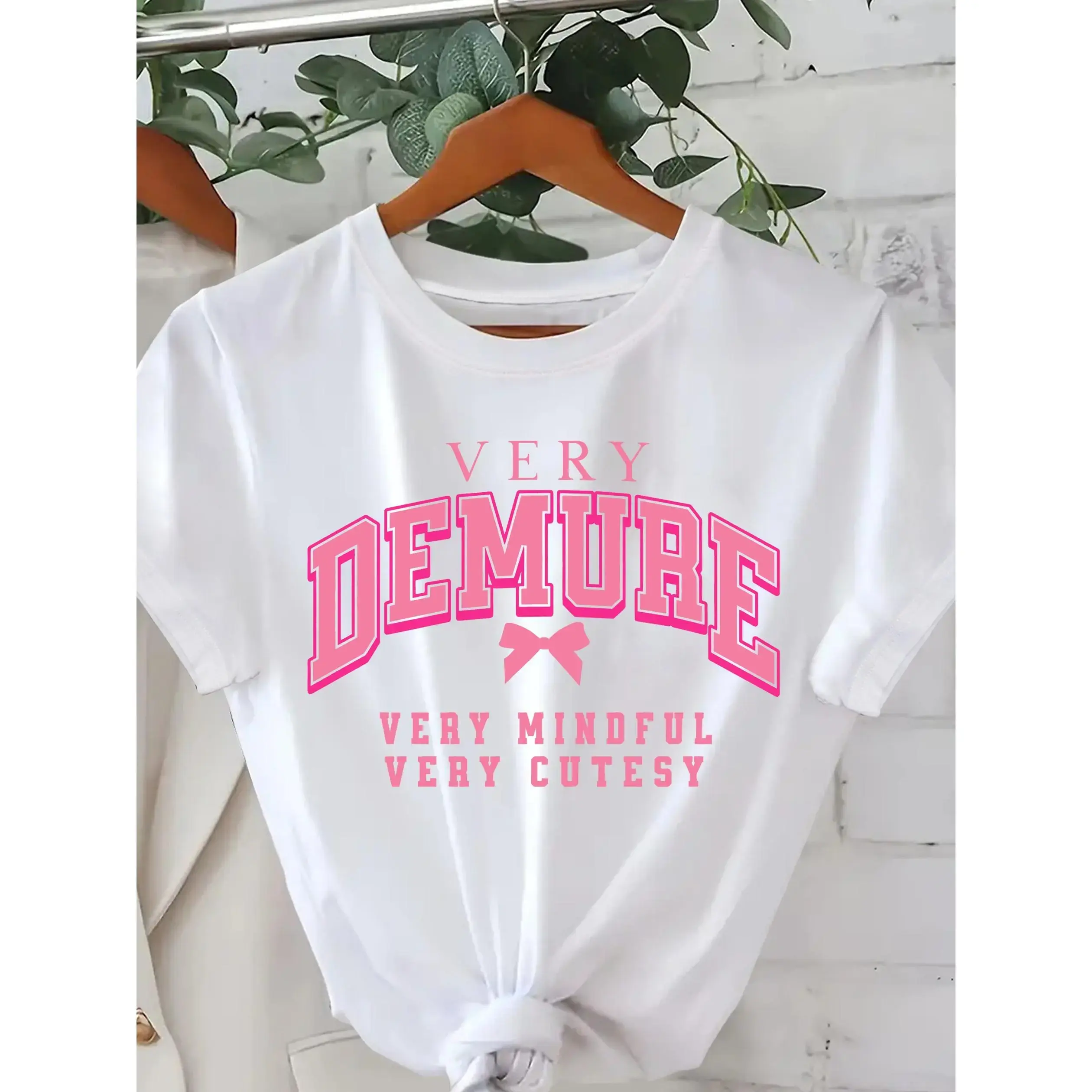 Everyday Comfort | Women's Casual "Very Demure" Graphic Tee with Bow Detail - Soft Knit, Short Sleeve, Round Neck, Spring/Summer Fashion Top, White with Pink Print, Fitness Attire | Bow Detail Shirt | Nontransparent Material