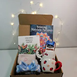 Blind Date With a Coloring Book including colored pencils, ceramic mug, fuzzy socks, spa head band and other goodies. Perfect gift idea.