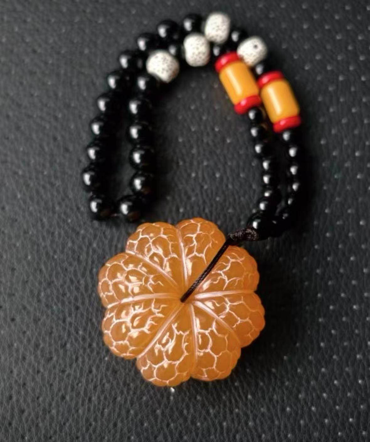 Oriental Gold Frozen Stone ornament, handheld piece, spinning craft item, souvenir gift, stress-relief spinning, hanging decoration, orange ornament