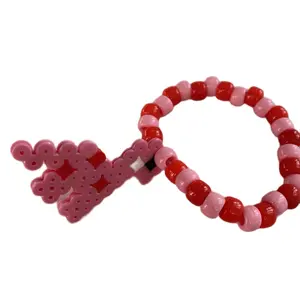 Baby Dino Rave Kandi Perler Bracelet- PLUR Festival Wear with Colorful Beads, Red and Pink design