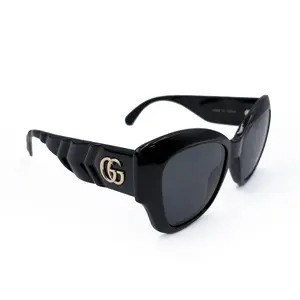 GUCCI Novelty Sunglasses Statement Cat-Eye Style Full-Frame Glossy Black Frames GG Hardware Tinted Lenses for Sun Protection