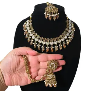 Desi Necklace Earrings Tikka Set with Decorative Elements and Matching Earrings