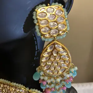 Tyanni Kundan Set with Intricate Gold Plated Design and Multi-Colored Beads for Festive Wear
