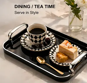 Sleek black tray with polished silver handles comes in an elegant gift box. Ideal for housewarmings, weddings, or holiday presents. Elevate their home decor game!