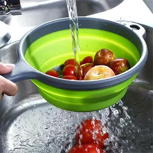 Foldable silicone drain basket with handle for draining and cleaning fruits and vegetables, designed as a foldable kitchen basket