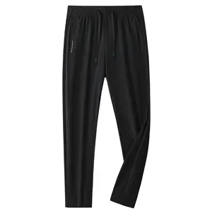 New women’s quick-dry athletic pants with a drawstring elastic waistband, lightweight casual design, zippered pockets, suitable for the gym, running, and fitness training.