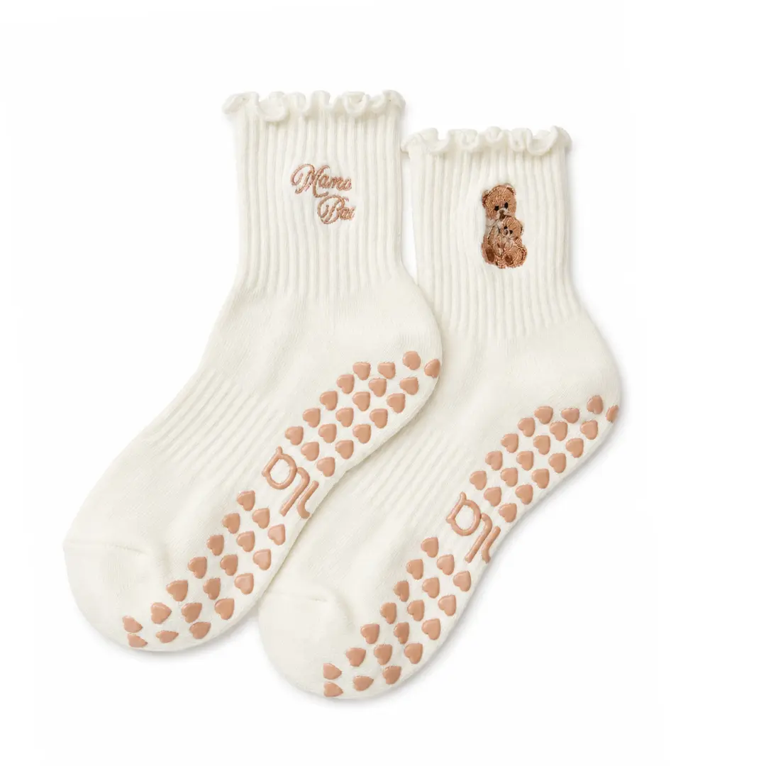 The Mama Bear Double Embroidery Grip Sock with brown heart-shaped grips for Pilates, Barre, Lagree, and Yoga