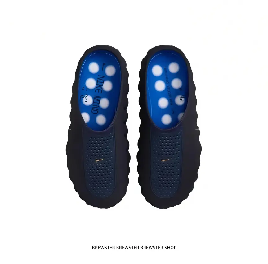 Upgrade your active recovery routine with these sleek black sport clogs the striking blue interior and light grey massage bumps provide targeted relief after intense workouts