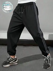 Men’s loose casual athletic pants with a drawstring waist; long pants for summer beach vacations, everyday wear, commuting, outdoor hiking, running, fitness, and jogging; relaxed fit; street-style ankle-length pants.