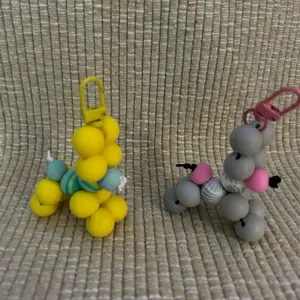 Balloon Dog Keyrings - Colorful Keychains Featuring Yellow and Gray Dog Designs with Hooks for Easy Attachment